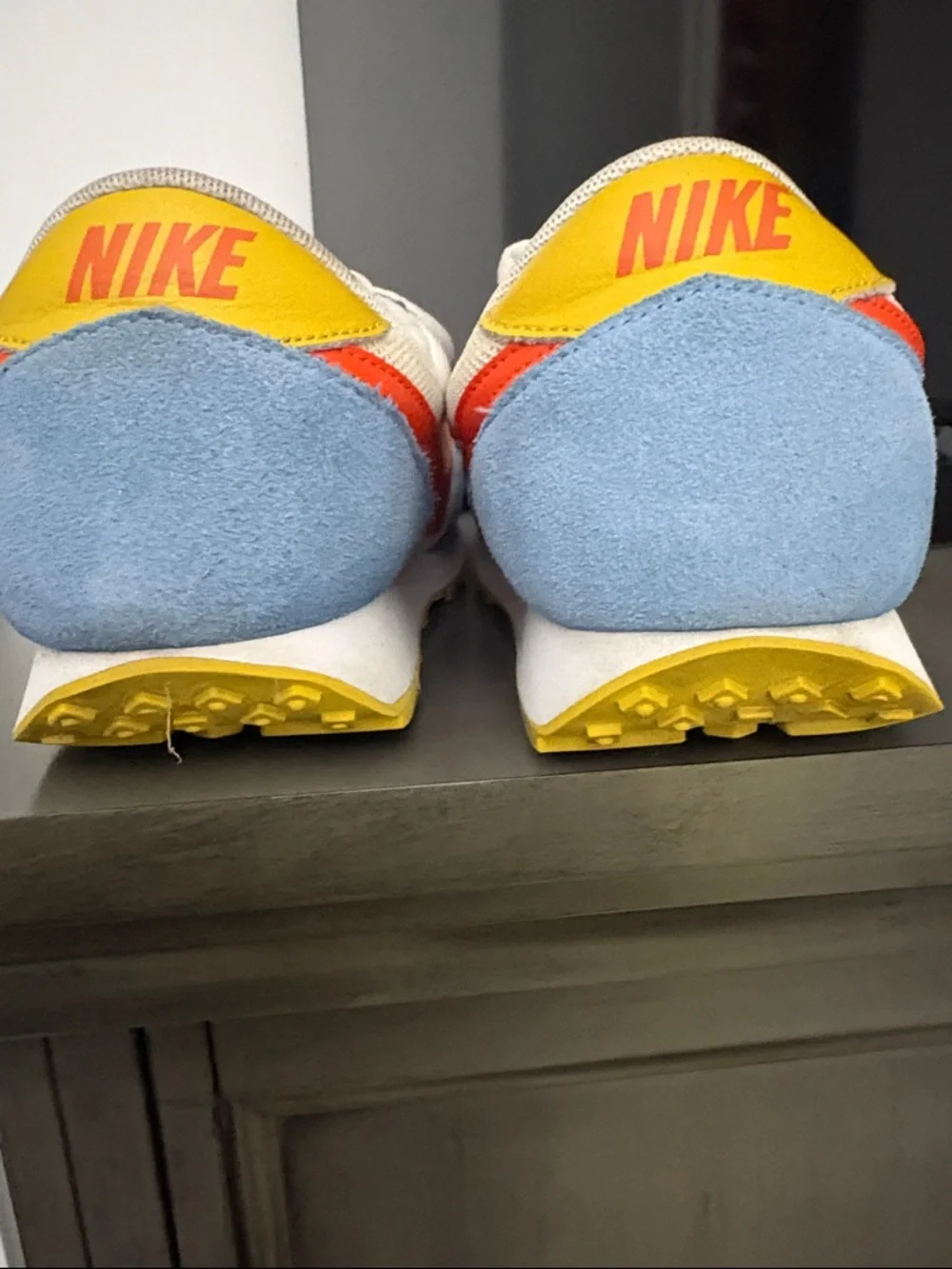 Nike Kids White Sneakers with Light Blue Panels and Orange Swoosh